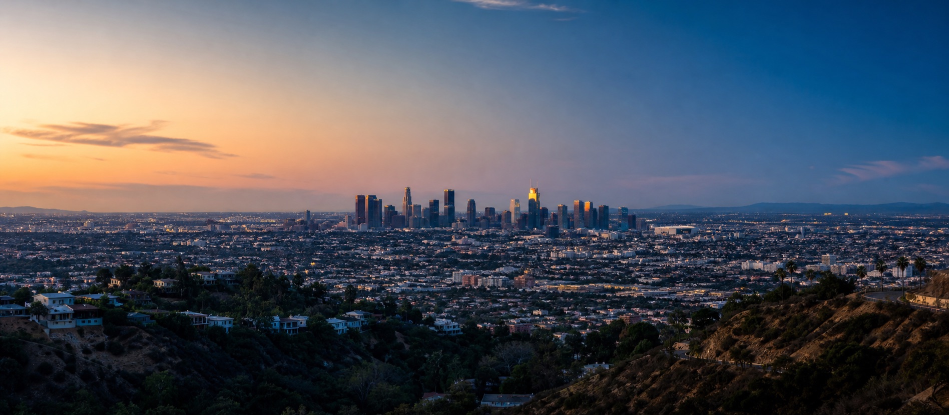A wide evening view across Los Angeles toward the downtown skyline